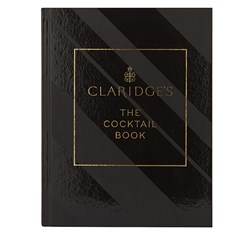 The sight of a luxurious book in a rich print with a black cover and gold lettering, the Claridge's cocktail book.